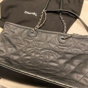 A black Chanel tote in very good condition, no marks.